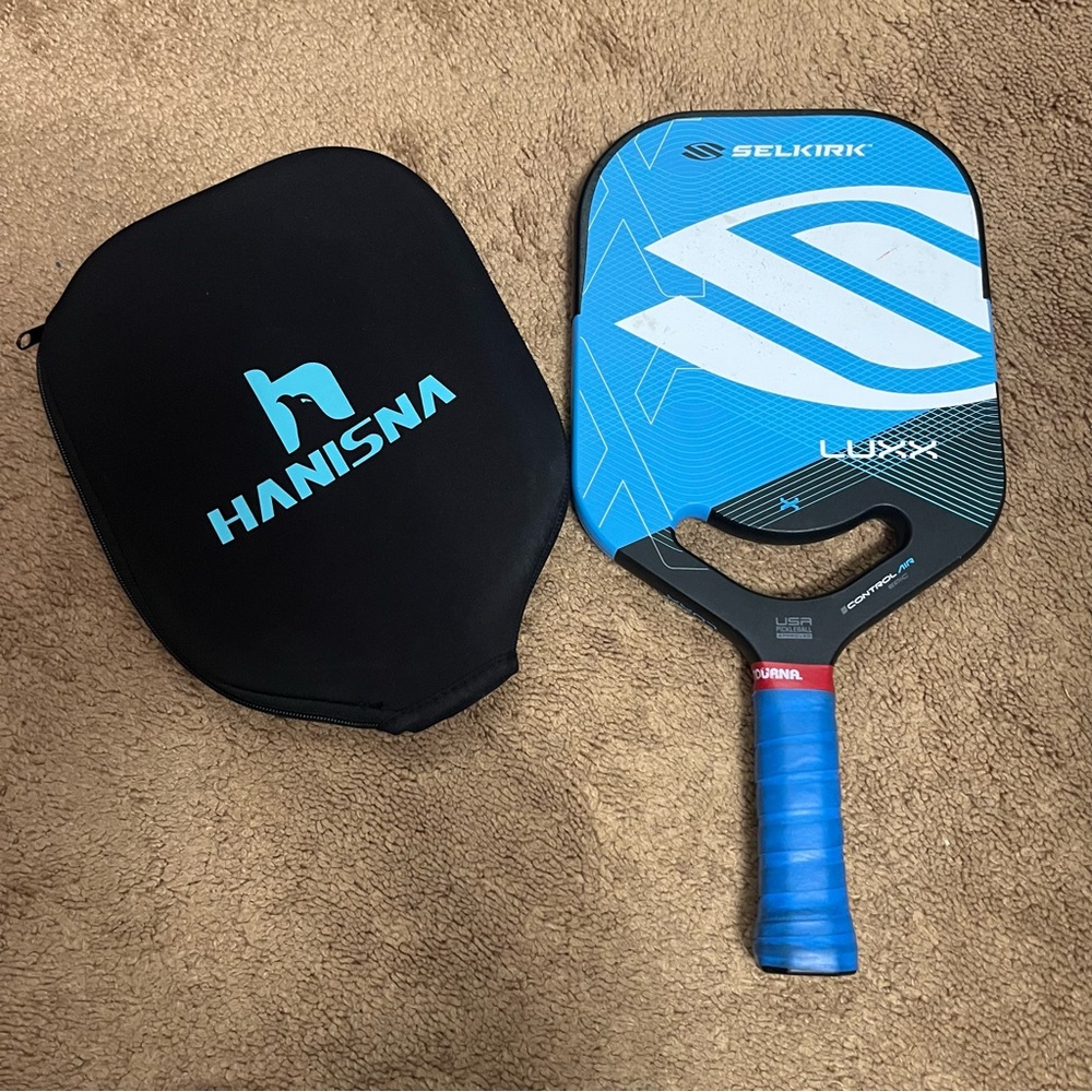 Blue Selkirk epic luxx pickleball paddle.